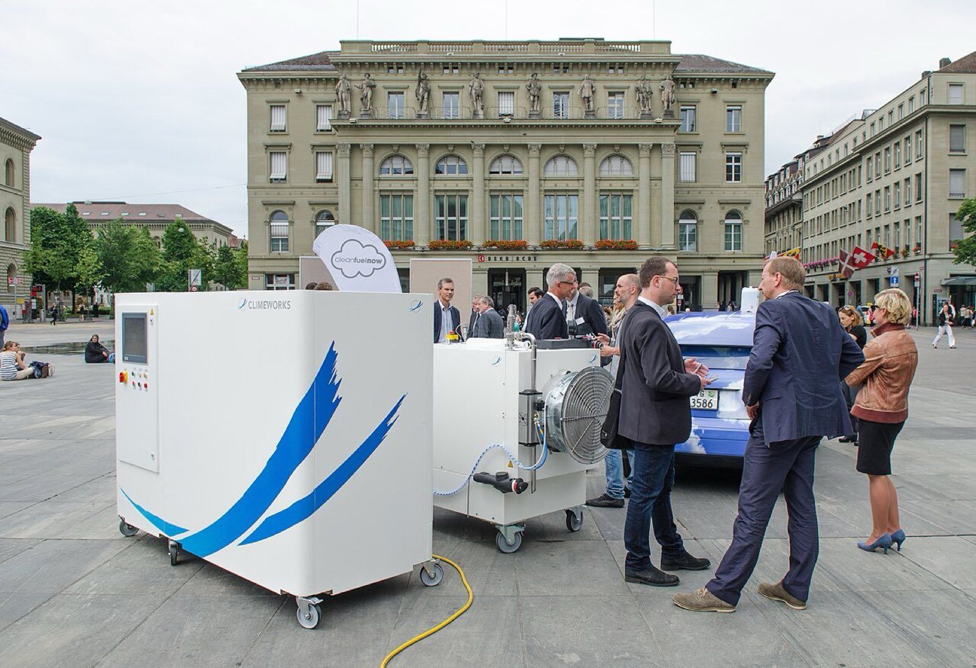 A small Climeworks direct air capture demonstrator unit on a public square in Bern